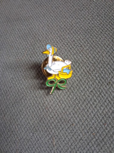 Macmillan cancer relief pin - relief,