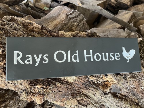 Deep engraved slate - house, sign