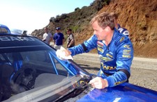 Tommi Makinen cleans the