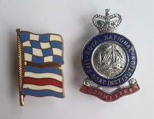 Maritime signal flag "I am in distress and require assistance" and RNLI badge