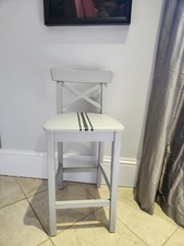 Wooden bar stool with painted French stripe and seat cushion