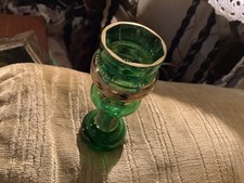 small green vase with gold coloured decoration