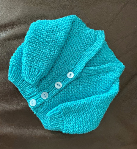Hand knitted torquoise wool - hand,