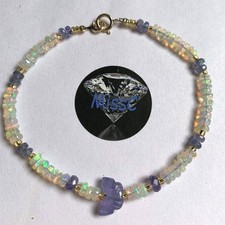 9CT GOLD TANZANITE AND FIRE OPAL BUTTERFLY BRACELET, STAMPED 375, HANDMADE IN UK