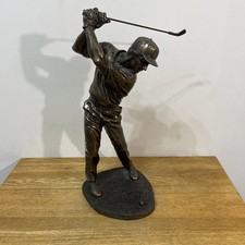 Bronze sculpture of a golfer