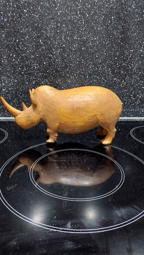 Wooden hand carved rhino - hand,