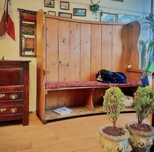 A fantastic 19th century pine, barrel back tavern settle/bench.