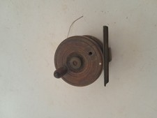 old wooden fishing reel (