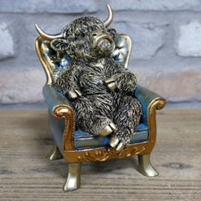 Small Highland Cow On Chair