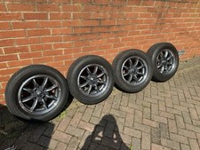 Set of four 15 x 5.5j JBW minilite wheels with tyres