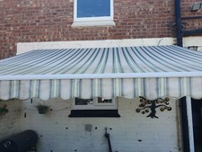 wind out awning for house