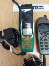 Old mobile phones - GSM (with case), Nokia (x3) and Sony Eriksson. 3 x Chargers.