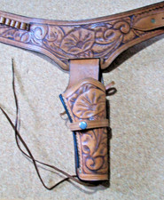 light brown tooled leather gun belt & holster right handed up to a 44 waist