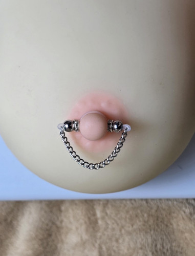 Pair fake nipple rings - of,
