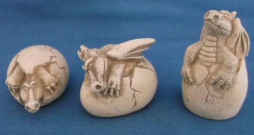 Dragons emerging from eggs - dragons,