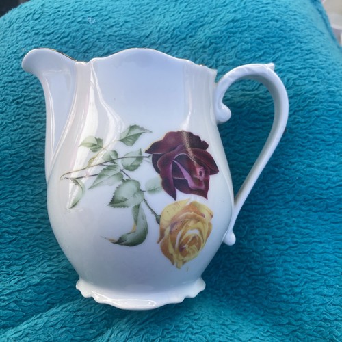 Vtg floral milk jug - vtg,
