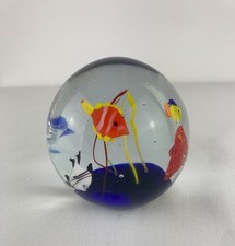 Globe glass paper weight with - paper,