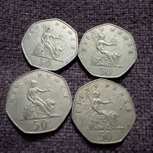 Old large style 50p coin - old,