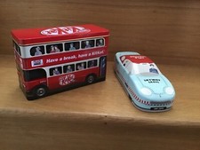 2 collectible tins a Kit Kat
