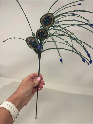 Beaded peacock feathers for - for, a