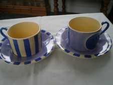 WHITTARD OF CHELSEA SET OF TWO CUPS WITH MATCHING SAUCERS IN BLUE / LILAC.