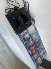PlayStation 4 Slim 1TB with 2 x controllers and 9 games.