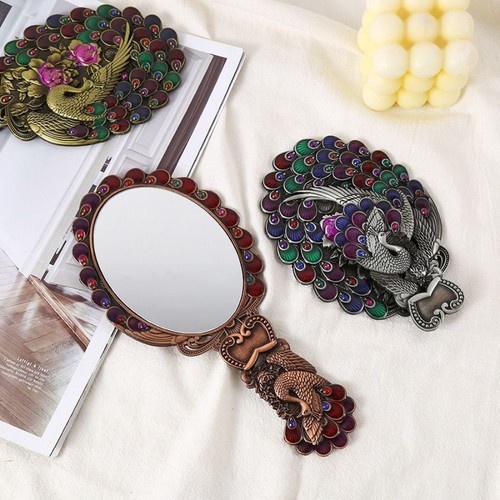 Hand held peacock makeup - hand-held,