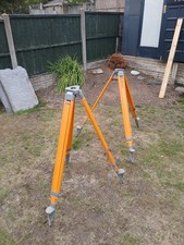Surveyors Wooden Tripods In Good Condition With Leather Strapping.