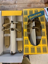 2 door handle sets in a brass