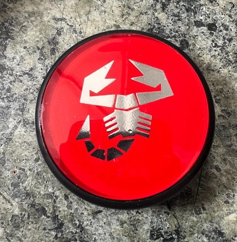 New fiat alloy wheel center - new,