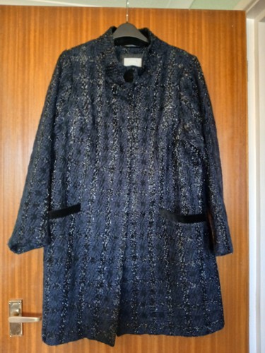 Per una sparkly coat with - per,