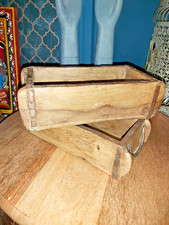 A PAIR OF TRADITIONAL VINTAGE INDIAN WOODEN BRICK MOULDS WITH IRON HANDLES