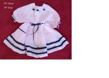 Gorgeous little dress in pale pink with navy trim, ribbon and rosebuds