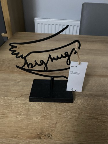 Next big hugs wire sculpted - next,