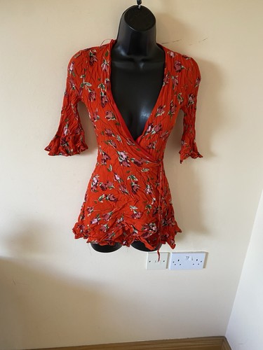 Red floral wrap style playsuit - wrap,