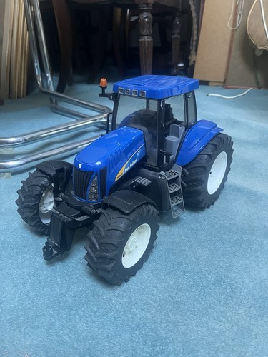 Bruder new holland t8040 blue - new,