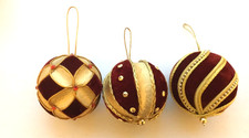 3 red and gold Harrods baubles