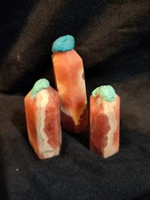 Trio of stunning rhodochrosite crystal towerd