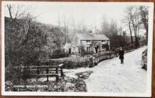 RPPC VIEW OF MAN STANDING BY COTTAGE IN COOMBE DINGLE BRISTOL SOMERSET H HODDER