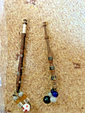 Two antique wooden lace bobbins with pewter decoration