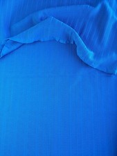 large piece of thick, heavy, synthetic bright dark blue fabric 125cm by 150cm.
