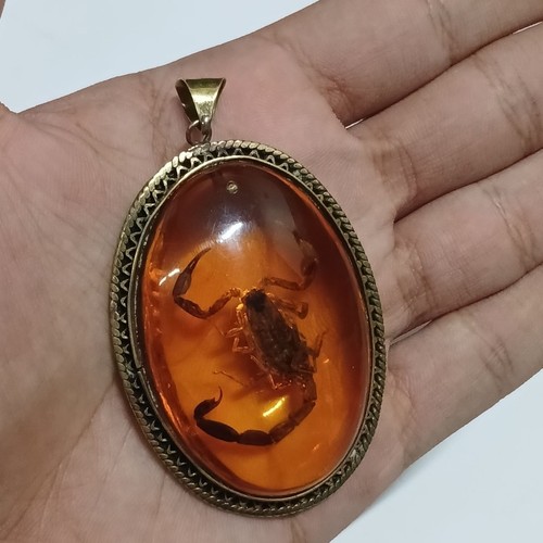 Oval brass pendant with - with, real