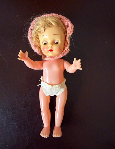 Plastic doll with - jointed, arms
