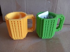 2 x Lego Mugs complete with two cars.