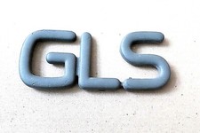 GLS GREY PLASTIC CAR BADGE, possibly for VAUXHALL ASTRA Mk.2 / Mark II