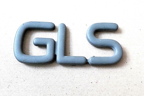 Gls grey plastic car badge - car,