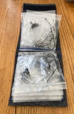 SEA RIG WALLET WITH 10 COD PENNELL RIGS WITH SIZE 3/0 HOOKS