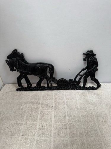 Cast iron relief - plough, horse