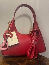 red shoulder bag with strap
