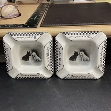  2 YES A PAIR OF BLACK & WHITE WHISKY ASHTRAYS BOTH IN VERY GOOD CONDITION